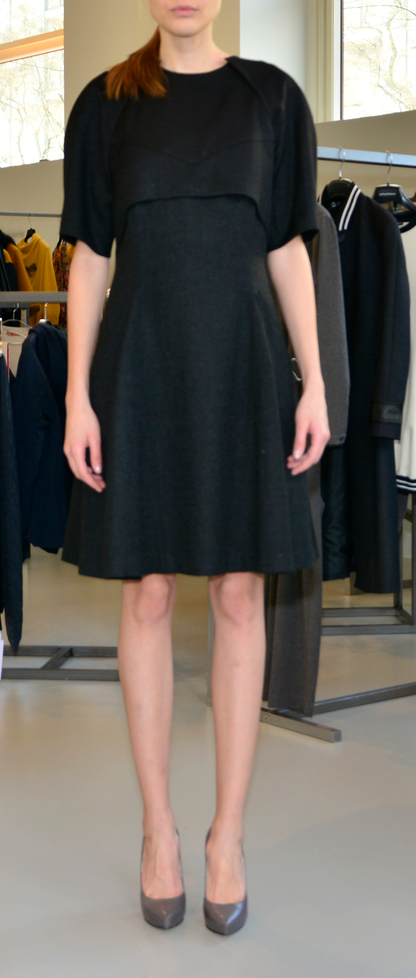Knee-length black dress with short sleeves